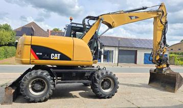 Cat M 313 D wielgraafmachine (bj 2013) beschikbaar voor biedingen