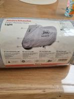 Afdekhoes motorfiets louis, Ophalen