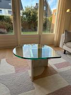 Glazen druppelvormige salontafel op travertin poot, Huis en Inrichting, Tafels | Salontafels, Ophalen, 50 tot 100 cm, 50 tot 100 cm