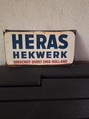 Oud emaille reclamebord Heras Hekwerk  beschikbaar voor biedingen