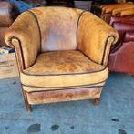 Schapenleren fauteuil sleets / geleefd voor weinig
