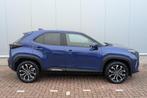 Toyota Yaris Cross 1.5 Hybrid First Edition Automaat, Achter, Auto's, Stof, Blauw, 116 pk, 1490 cc