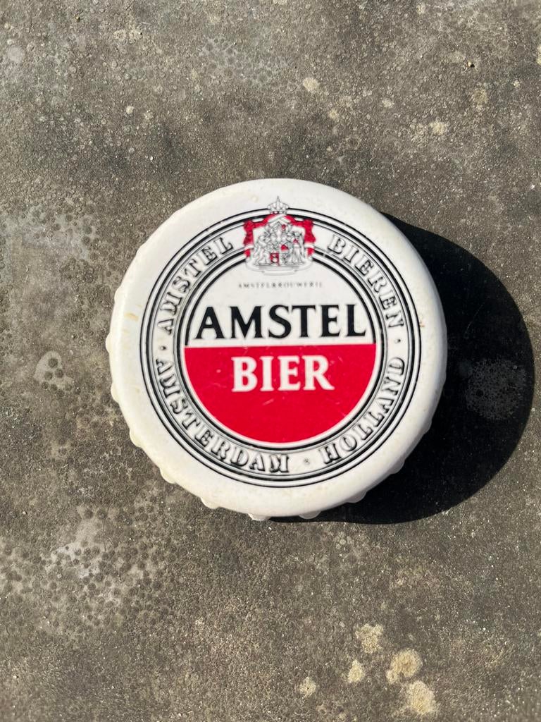 Amstel Bier flessenopener in de vorm van een bierflesdop, Verzamelen, Biermerken, Ophalen of Verzenden, Zo goed als nieuw, Flesopener