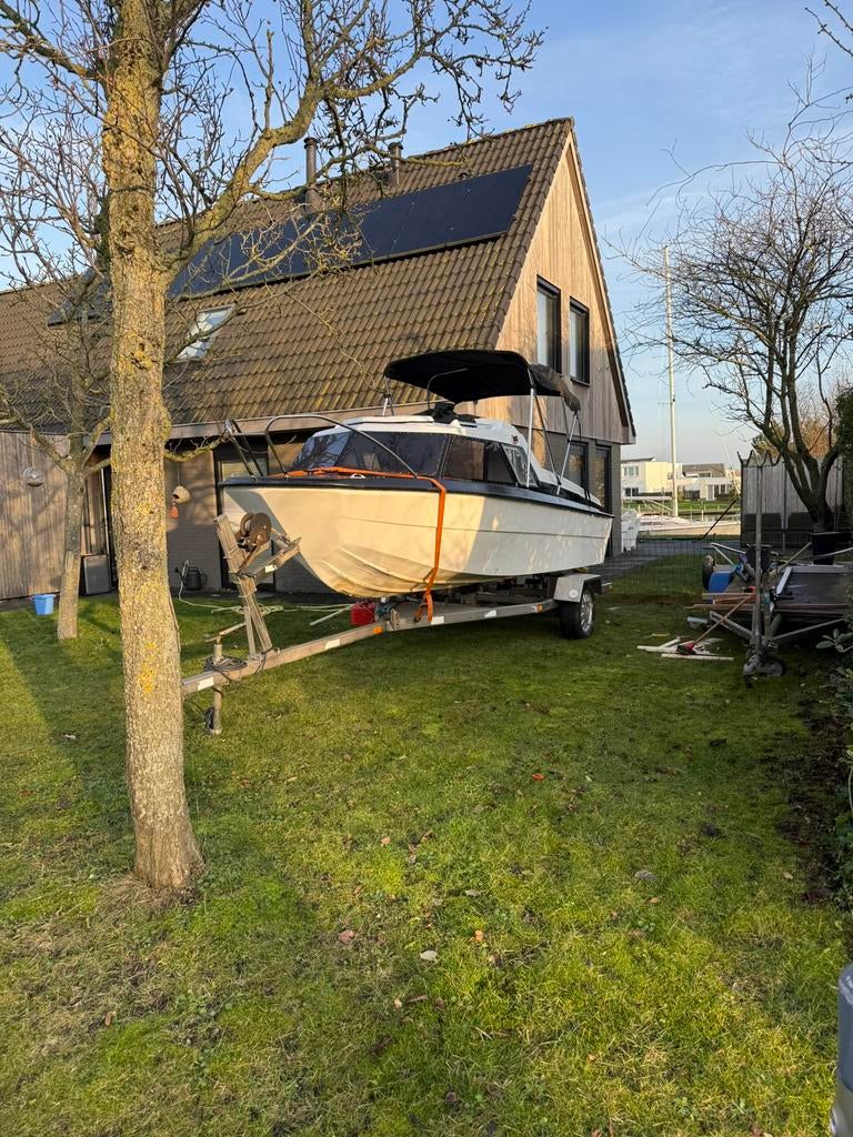 Microplus met 60 pk 2 takt mercury en rvs trailer, Watersport en Boten, Vis- en Consoleboten, Gebruikt, Ophalen of Verzenden, 3 tot 6 meter
