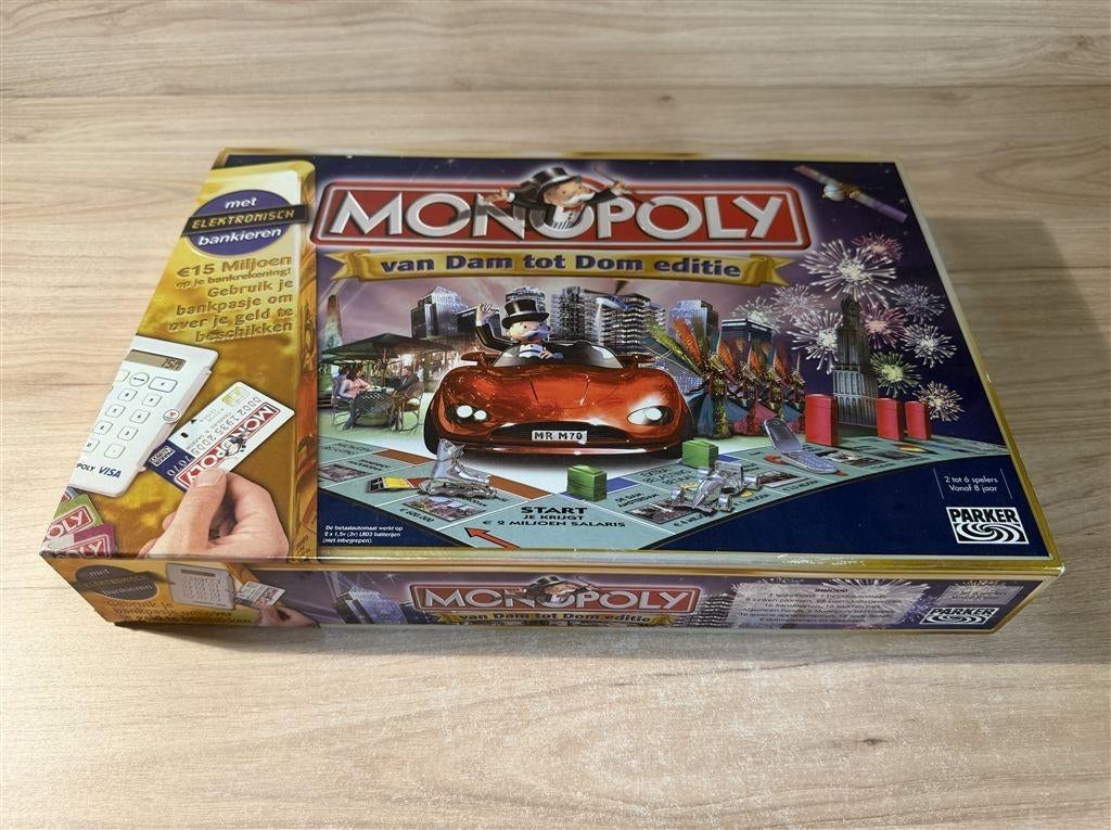 Monopoly van Dam tot Dom - s6129, Hobby en Vrije tijd, Gezelschapsspellen | Bordspellen, Verzenden, Zo goed als nieuw