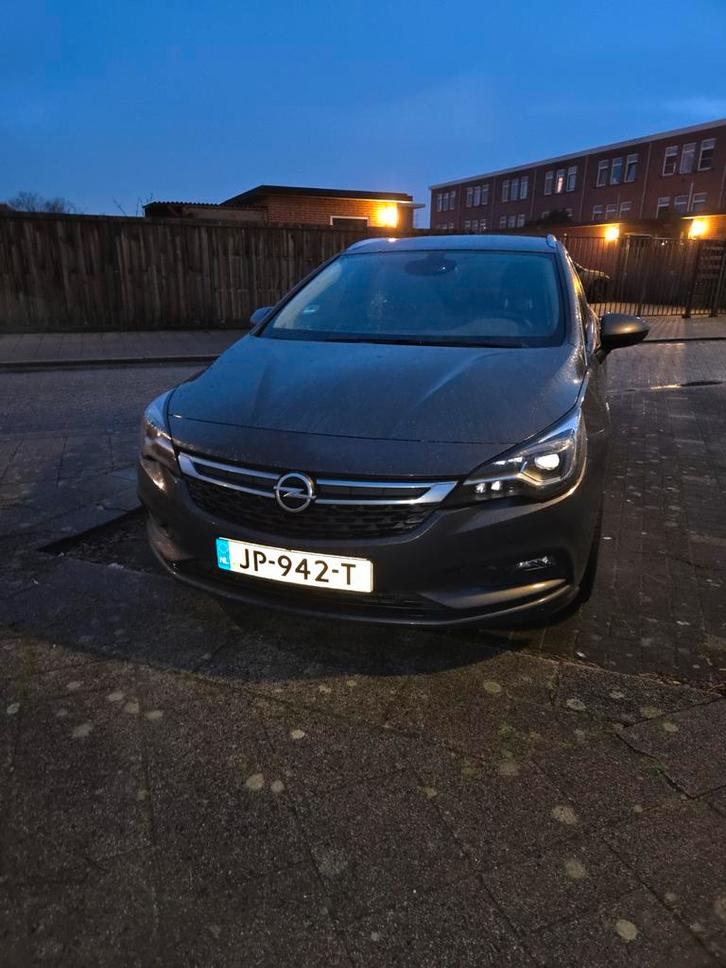 Opel Astra 1.4 Turbo 110KW Sports Tourer 2016 Grijs, Auto's, Opel, Astra, Achteruitrijcamera, Adaptieve lichten, Airbags, Airconditioning
