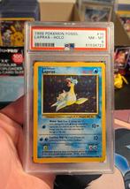 Lapras 10/62 Fossil Holo - PSA 8, Hobby en Vrije tijd, Verzamelkaartspellen | Pokémon, Ophalen of Verzenden, Zo goed als nieuw