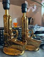 Twee gouden “GUN” pitolen lampjes, Huis en Inrichting, Ophalen of Verzenden, Zo goed als nieuw, Minder dan 50 cm