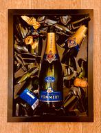 Champagne fles in epoxy gegoten, Ophalen