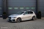 BMW M140i xDrive High Executive|Schuifdak|Harman-Kardon|Maxt, Stof, Gebruikt, 340 pk, 14 km/l