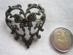 32.  Schitterende oude broche, Ophalen