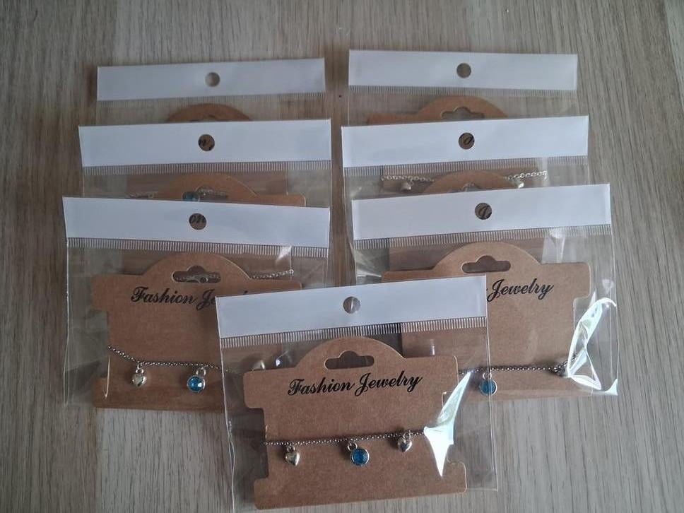 7x Kinderbedelarmbandjes - Zilverkleurig en Blauw, Sieraden, Tassen en Uiterlijk, Kindersieraden, Ophalen of Verzenden, Nieuw