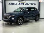 Hyundai Tucson 1.6 T-GDI PHEV Comfort 4WD Automaat / Navigat, Auto's, Automaat, Gebruikt, 4 cilinders, Blauw