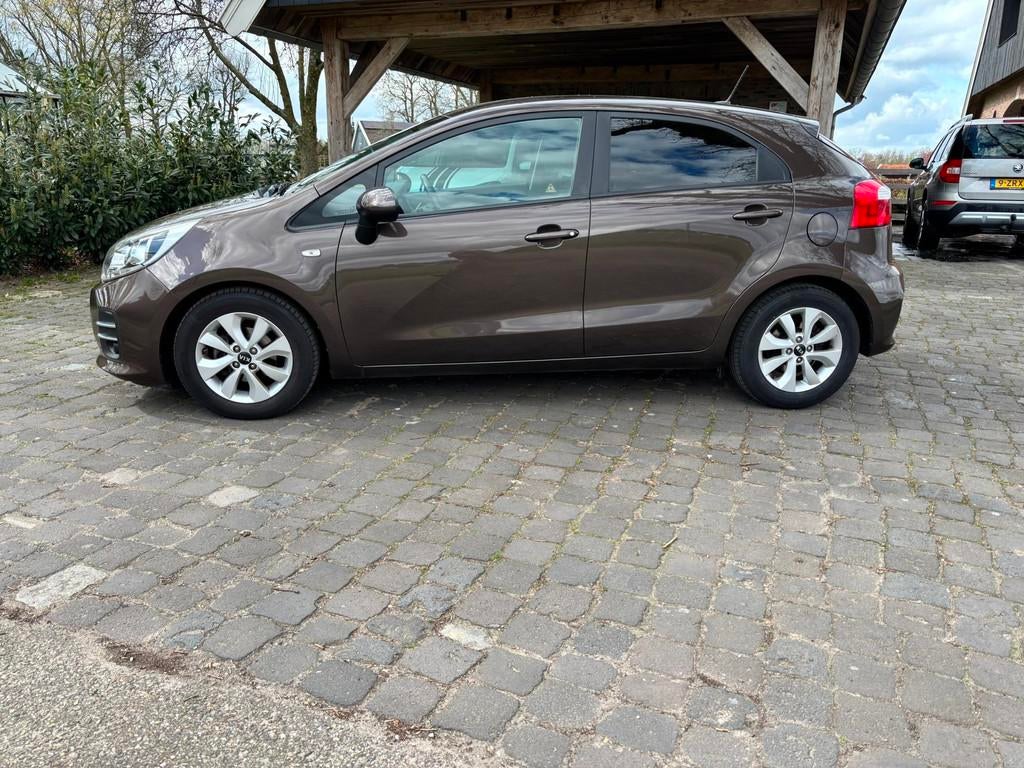 Kia Rio 1.2 CVVT ComfortPlusLine Navigator, 4 cilinders, Bruin, Bedrijf, Handgeschakeld