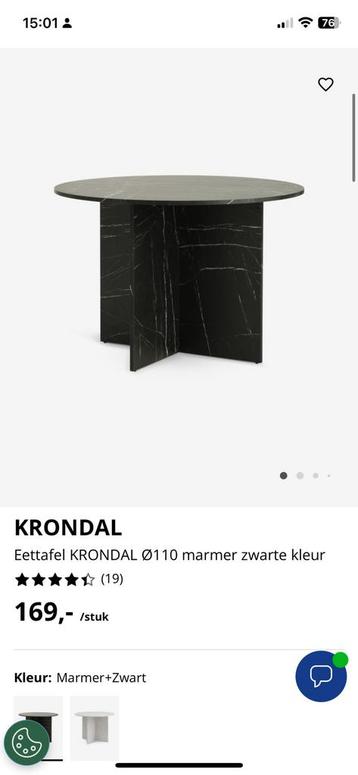 Ronde zwarte tafel beschikbaar voor biedingen