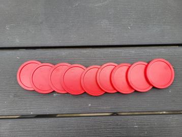 Air hockey puks beschikbaar voor biedingen