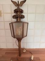 Koperen lamp met adelaar, Ophalen