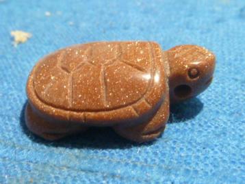 Hanger schildpad van goudsteen beschikbaar voor biedingen