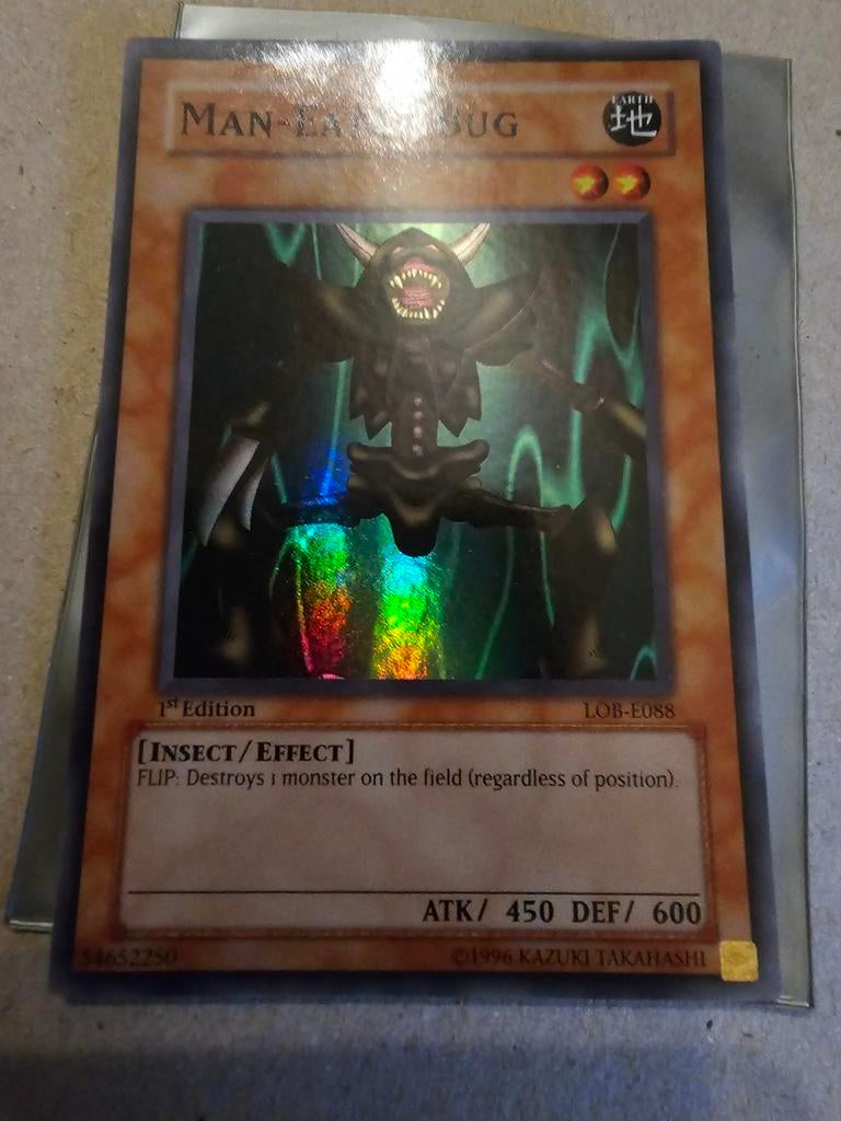 Yu-Gi-Oh! Man-Eater Bug LOB-E088 1st Edition Foil, Ophalen of Verzenden, Zo goed als nieuw, Losse kaart, Foil
