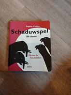 Suzanne Collins - Schaduwspel - 100 dieren, Fotograferen en Filmen, Suzanne Collins, Ophalen of Verzenden, Zo goed als nieuw