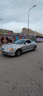 Hyundai Coupe 2.0 2002 Grijs, Origineel Nederlands, Te koop, Zilver of Grijs, 1400 kg