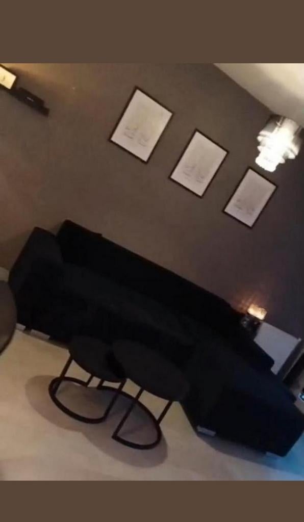 Zwarte ribstof hoekbank met opbergruimte en slaapfunctie, Huis en Inrichting, Banken | Bankstellen, Ophalen of Verzenden