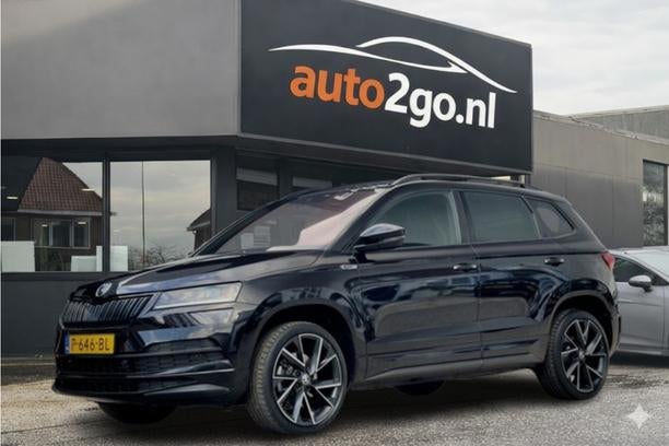 Skoda Karoq 1.5 TSI ACT AUT7 SPORTLINE NAVI CAMERA DIGI-DASH, Auto's, Euro 6, 4 cilinders, Zwart, 1500 kg