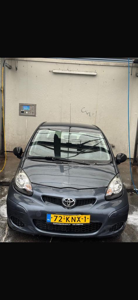 Toyota Aygo 1.0 12V Vvt-i 5DRS 2010 Grijs, Auto's, Toyota, Particulier, Aygo, Airbags, Android Auto, Apple Carplay, Bluetooth