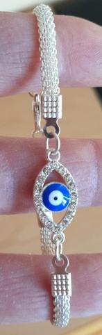 Zilverkleurig armbandje met oog - Nieuw, Overige materialen, Nieuw, Ophalen of Verzenden, Met strass