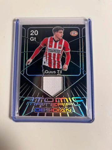 Guus Til atomic material /199 (panini obsidian, PSV) beschikbaar voor biedingen