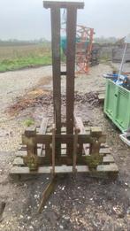 Palletvork achter tractor, Ophalen