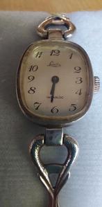 Vintage Zilveren opwind horloge Lasita 18cm, Overige merken, 1960 of later, Met bandje, Ophalen of Verzenden