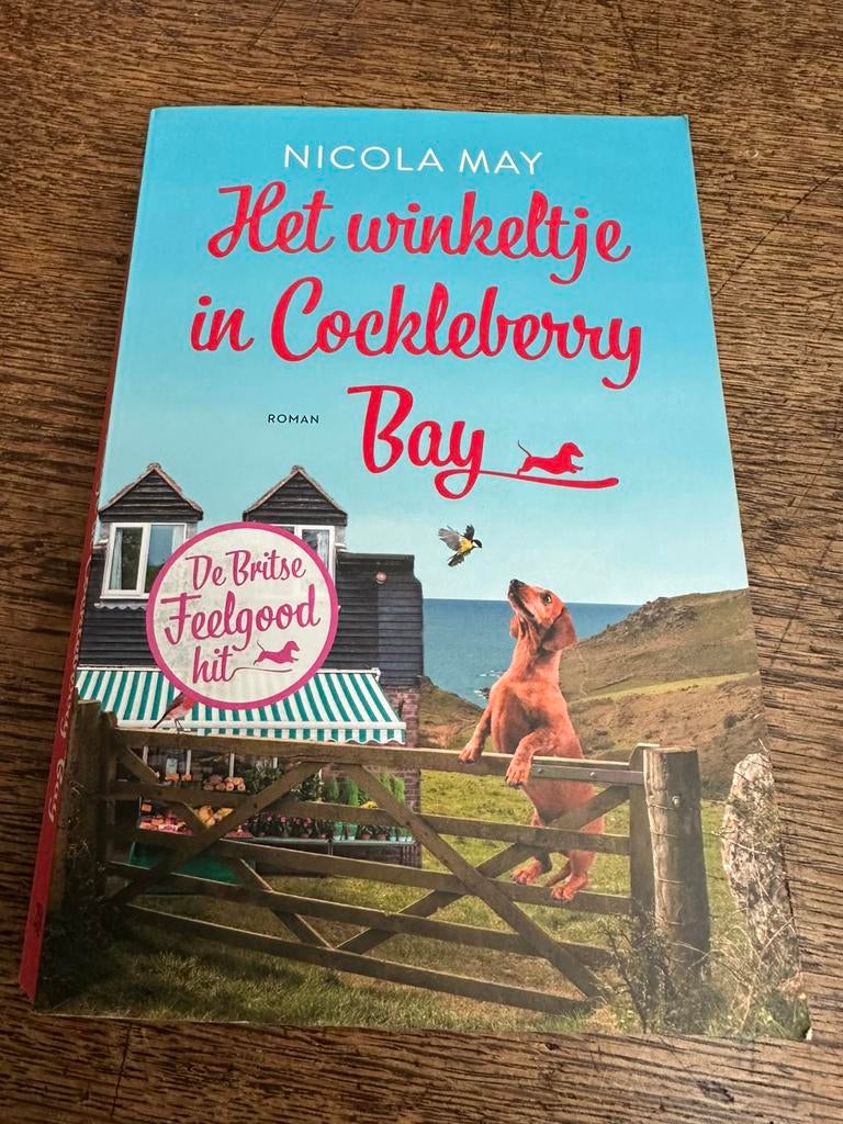 Nicola May: Het winkeltje in Cockleberry Bay, Ophalen of Verzenden, Zo goed als nieuw