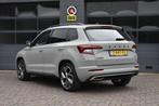 Skoda Karoq 2.0 TSI 4x4 Sportline Business, Auto's, Automaat, 12 maanden, Stof, Bedrijf