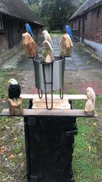 Houten beelden, Ophalen