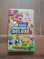 New Super Mario Bros. U Deluxe - Nintendo Switch, Spelcomputers en Games, Games | Nintendo Switch, Eén computer, Ophalen of Verzenden