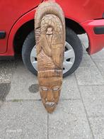 houten masker, Ophalen