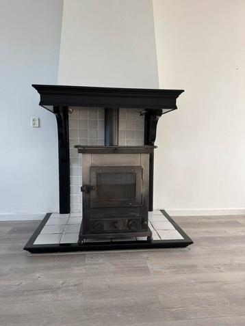 Houtkachel te koop – in goede staat beschikbaar voor biedingen