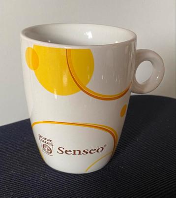 Senseo mok van Douwe Egberts (geel print). Hoogte 8,5 cm. beschikbaar voor biedingen