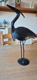 metalen reiger ter decoratie, Ophalen