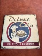 Metalen  wandbordje deluxe cakes, Ophalen of Verzenden, Zo goed als nieuw