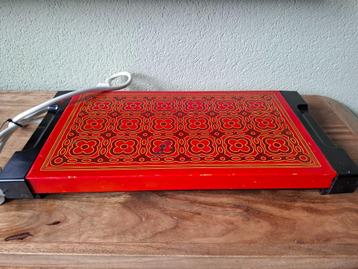 Vintage warmhoudplaat oranje  beschikbaar voor biedingen