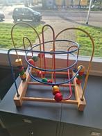 Kralenspiraal speelgoed, Ophalen