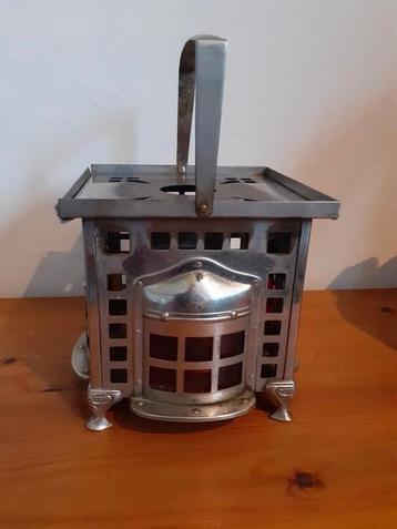 Rechaud metaal met rood glas beschikbaar voor biedingen