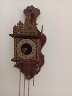 Antieke klok met gewichten, Ophalen