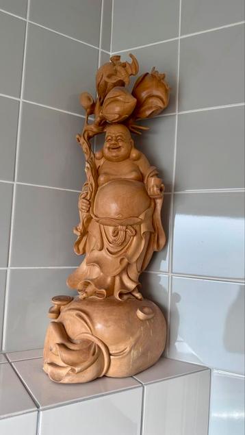 Lachende boeddha beschikbaar voor biedingen