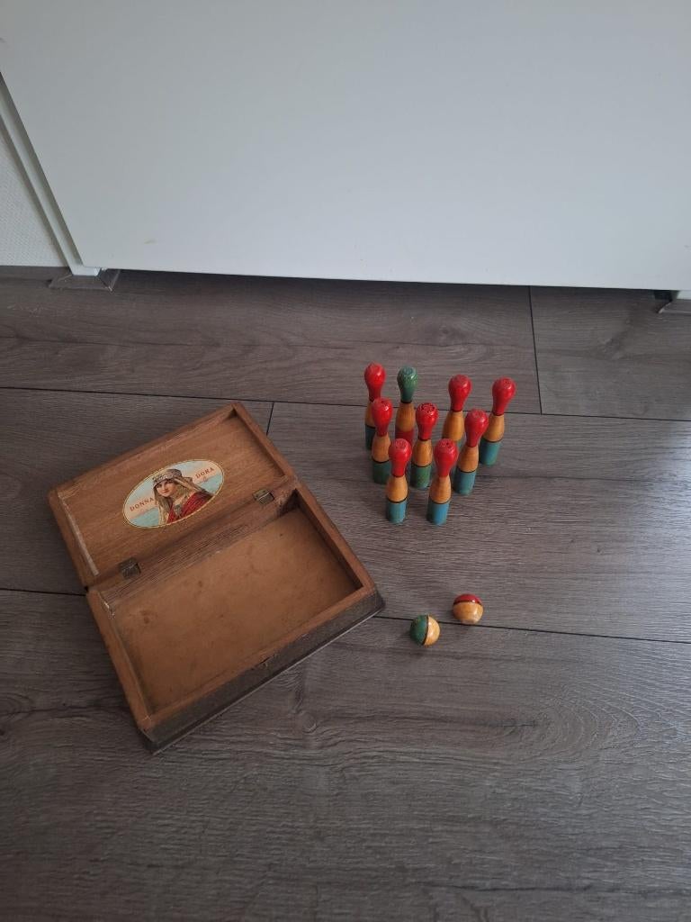 Houten kegel spel, Ophalen