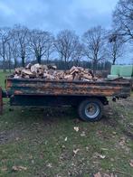 Kar met vers haardhout, Ophalen