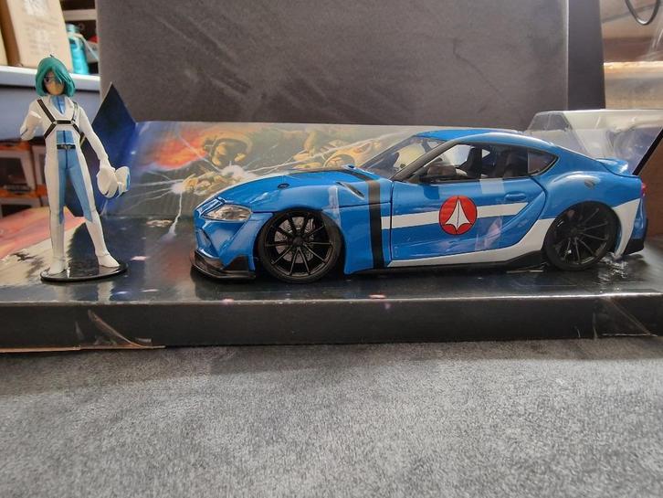 Toyota Supra met Max Sterling figuur "Robotech" Jada 1:24, Hobby en Vrije tijd, Modelauto's | 1:24, Nieuw, Auto, Jada, Ophalen of Verzenden