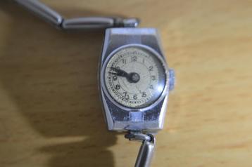 ca 80 jaar oud vintage dames horloge met elastische band  beschikbaar voor biedingen